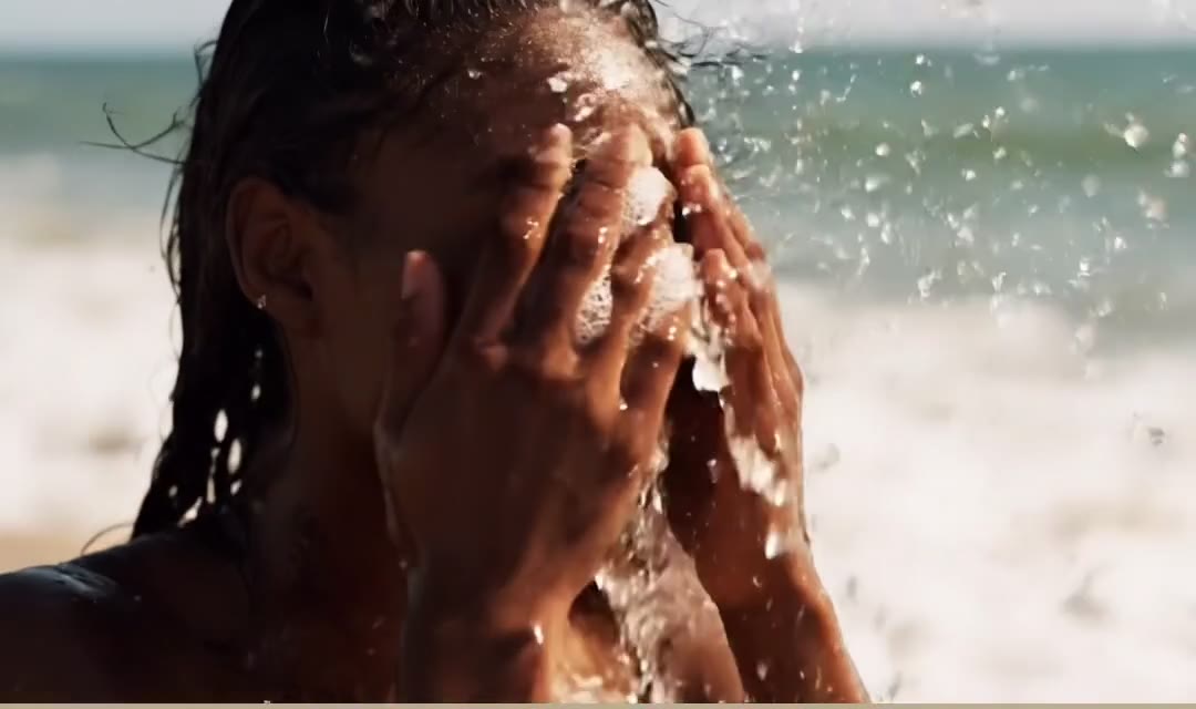 A still frame from the clinic film, showing soft natural light on melanin rich skin