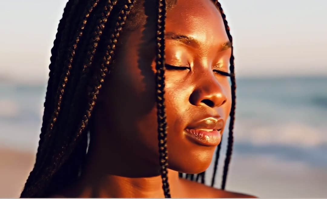 A portrait of a woman, smiling, in soft natural light